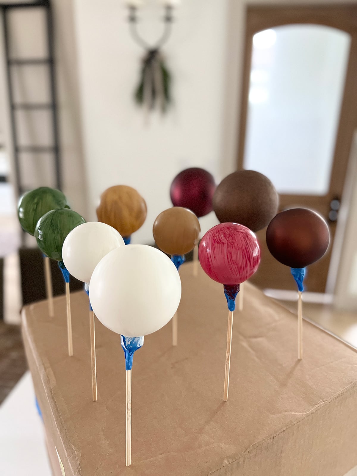 painted christmas ornaments drying