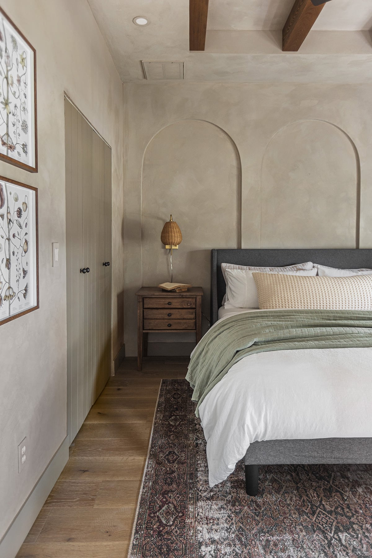 bedroom with soft taupe lime wash walls and arches