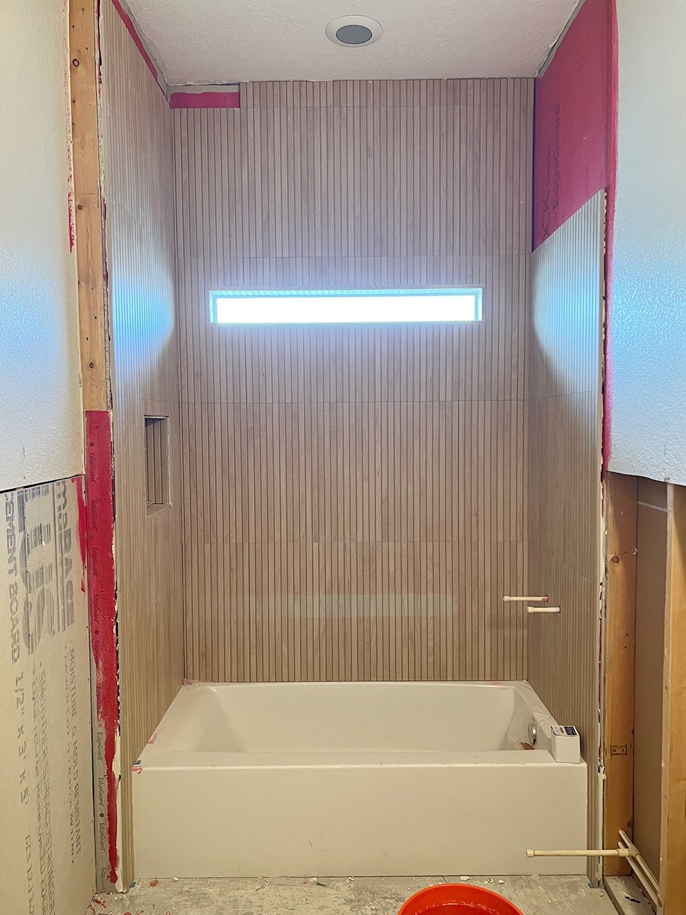wood tile installation in bathroom shower