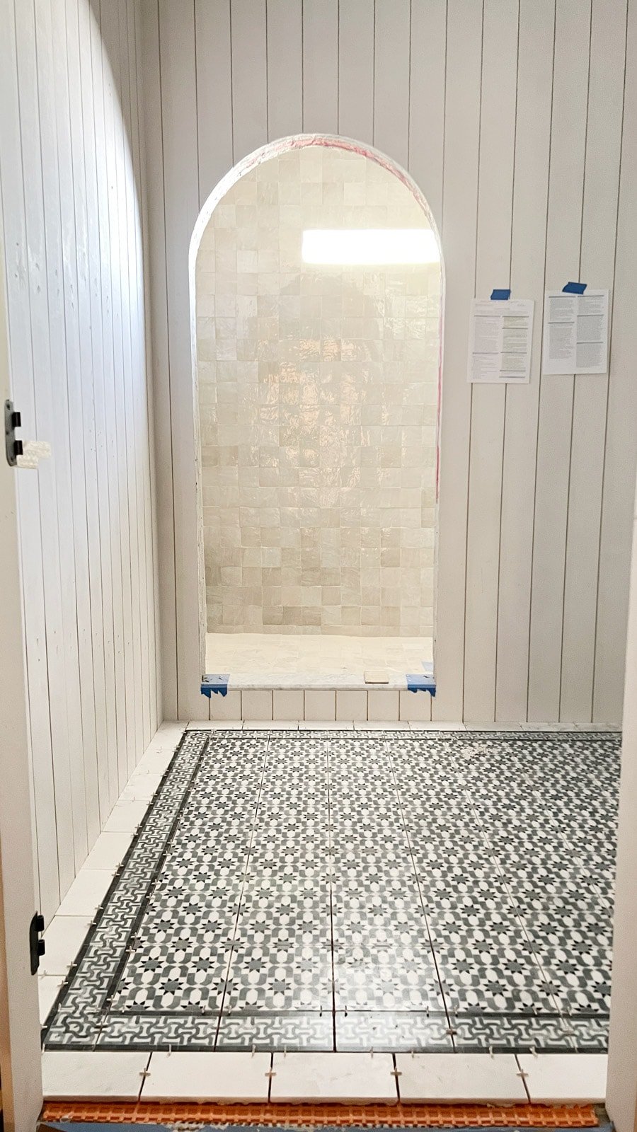 arched shower opening with shiplap walls, moroccan floor tile and zellige shower tile