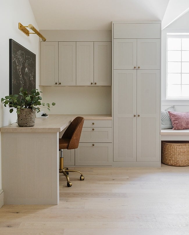 sherwin williams accessible beige on custom cabinetry in an office space