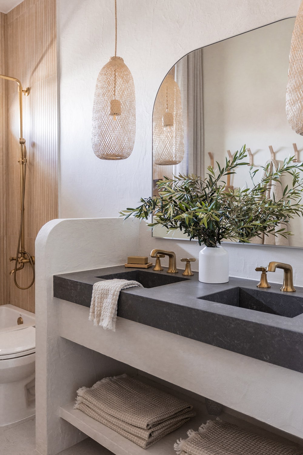 bathroom with diy microcement vanity and quartz counters with integrated sinks