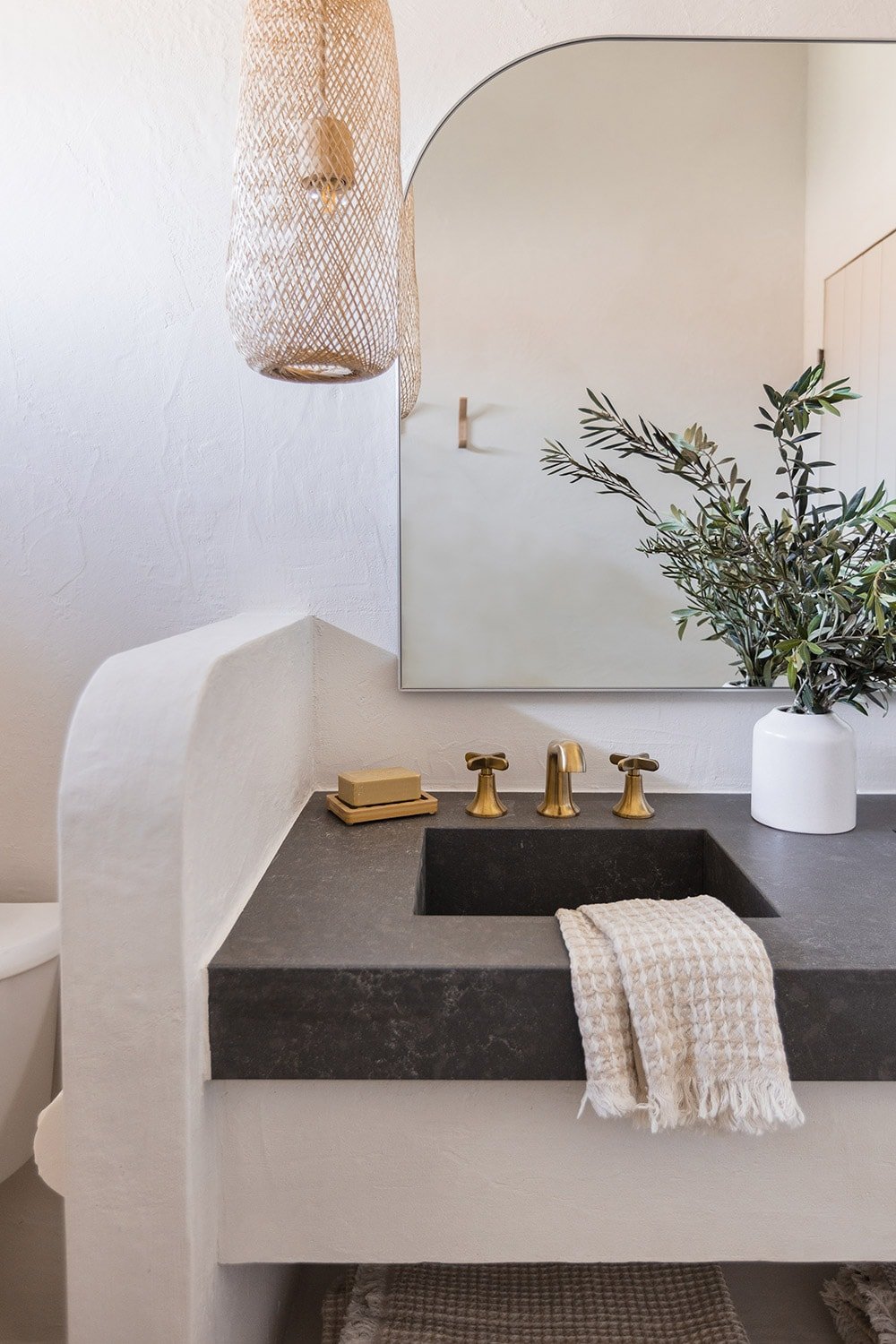 bathroom with diy microcement vanity and quartz counters with integrated sinks