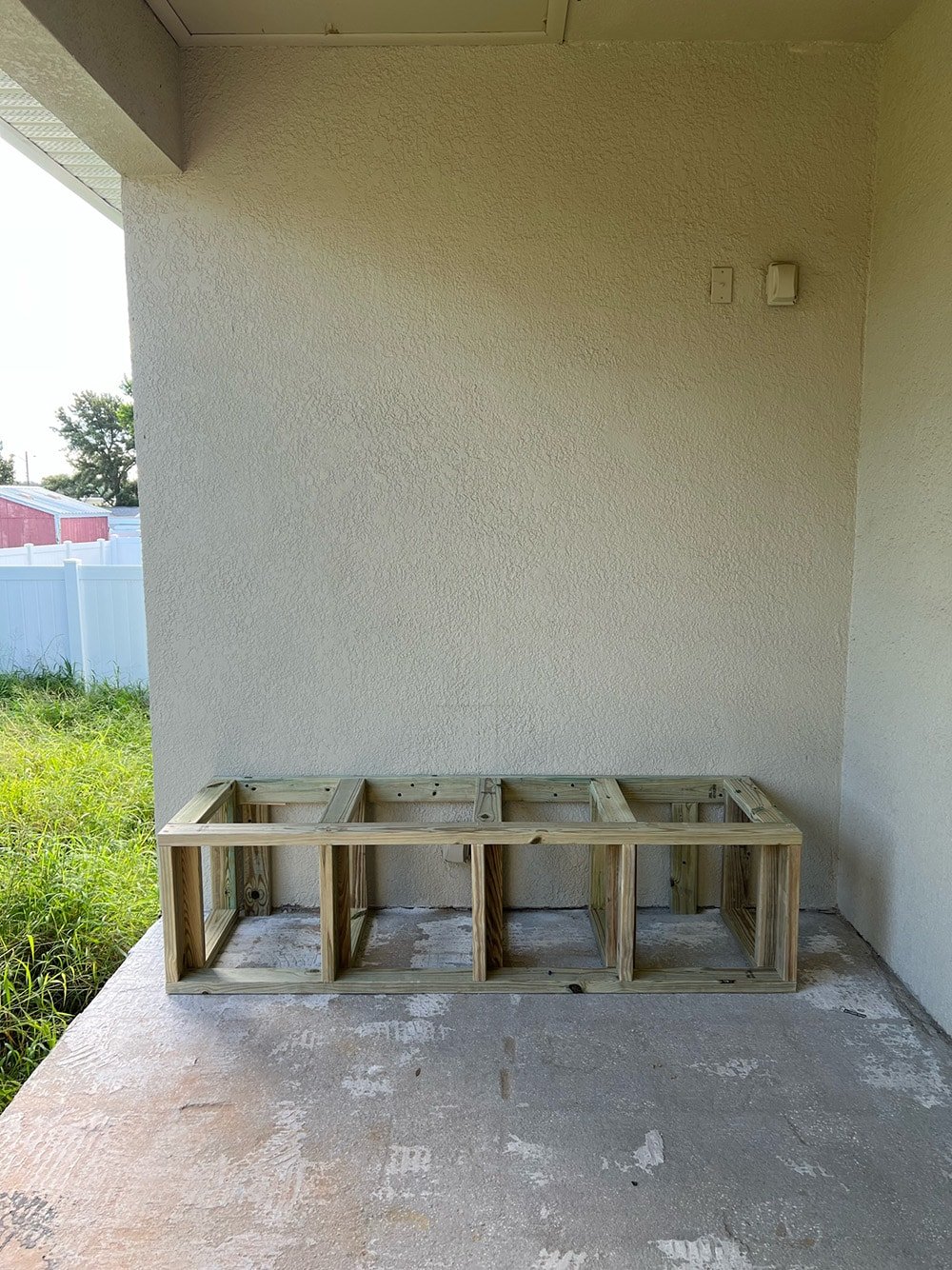 diy custom built in outdoor sectional sofa on a porch