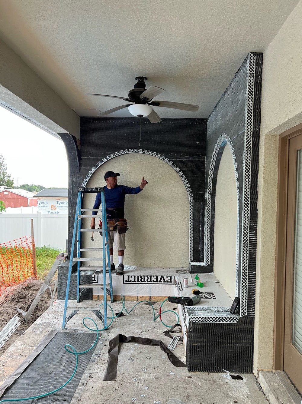 diy custom stucco arches on a covered porch