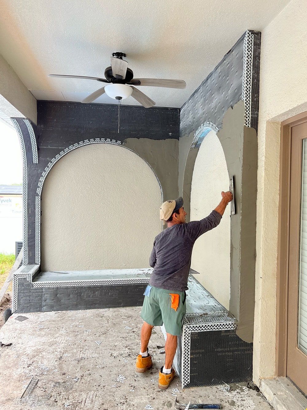 diy custom stucco arches on a covered porch