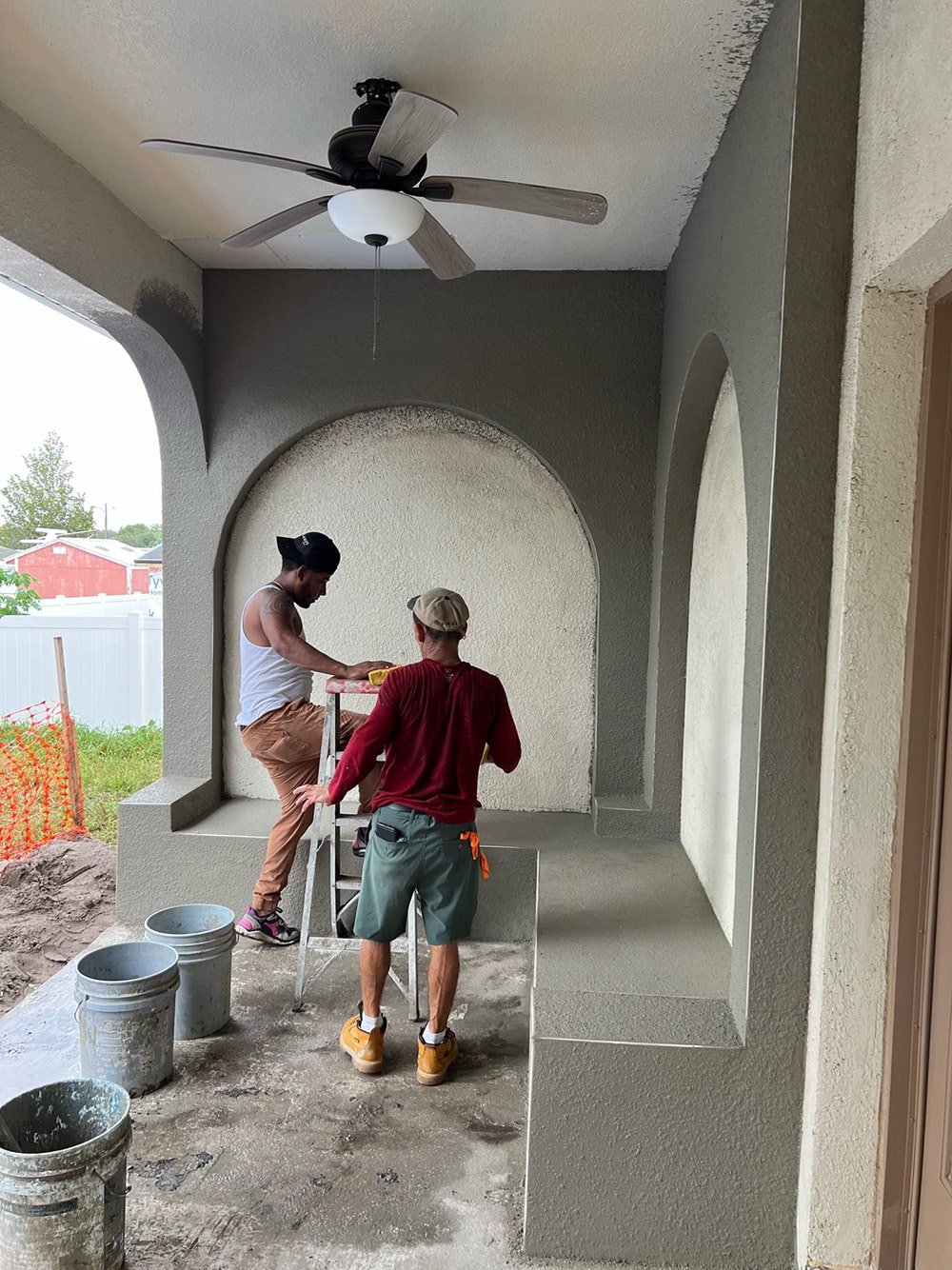 diy custom stucco arches on a covered porch