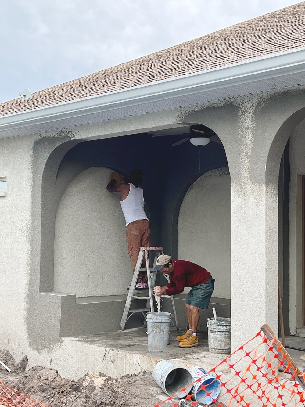 diy custom stucco arches on a covered porch