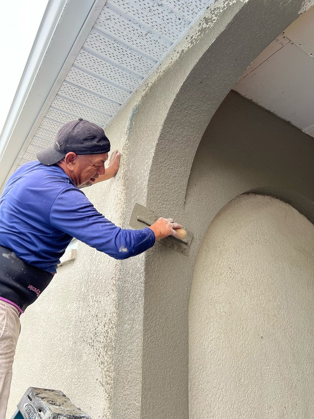 diy custom stucco arches on a covered porch