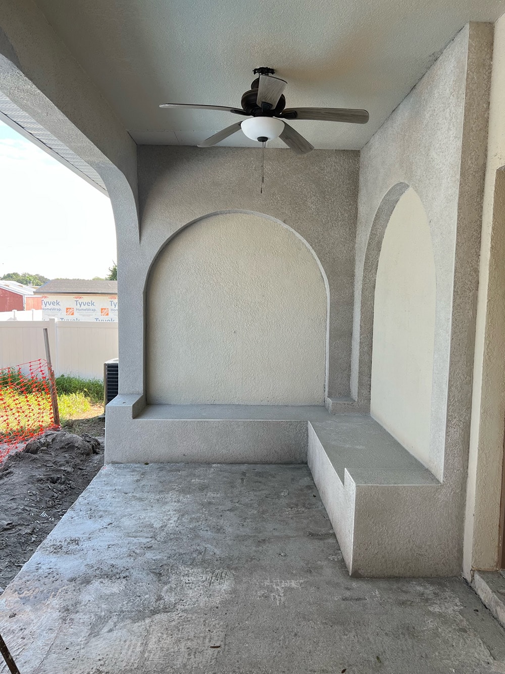 diy custom stucco arches on a covered porch