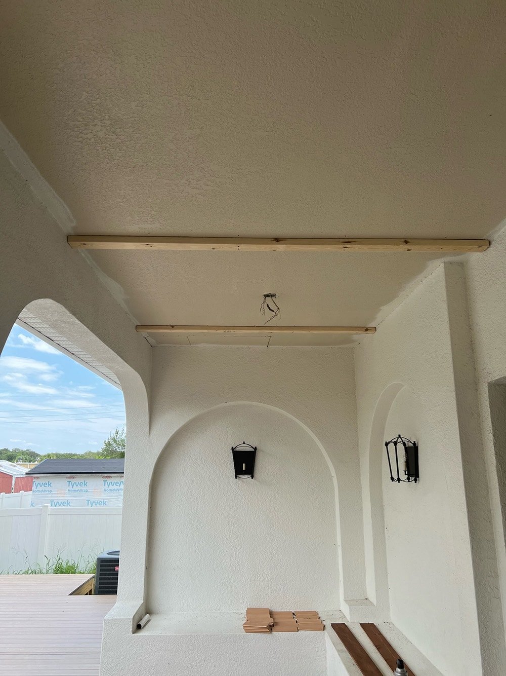diy wood beam and plank porch ceiling