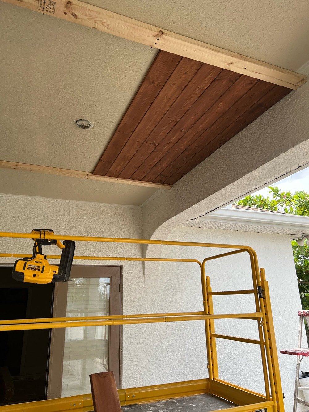 diy wood beam and plank porch ceiling