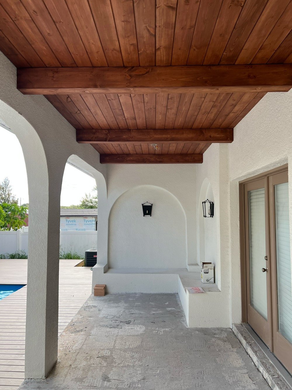 diy wood beam and plank porch ceiling