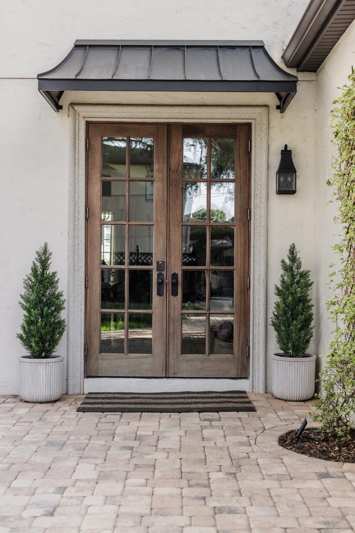 back patio with pavers and wood french double doors 