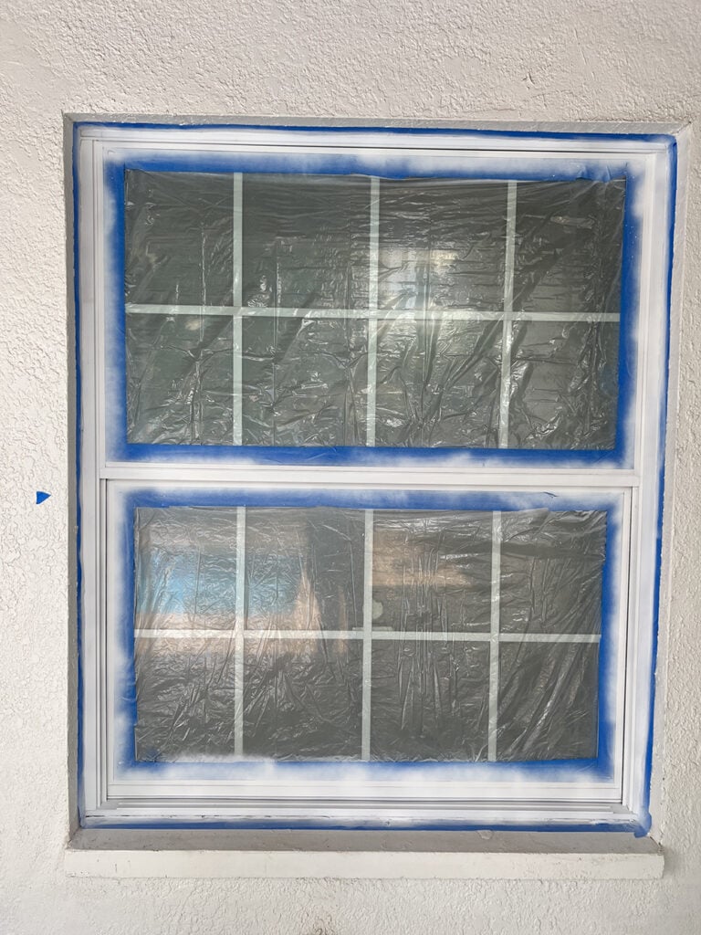 spray priming window frame