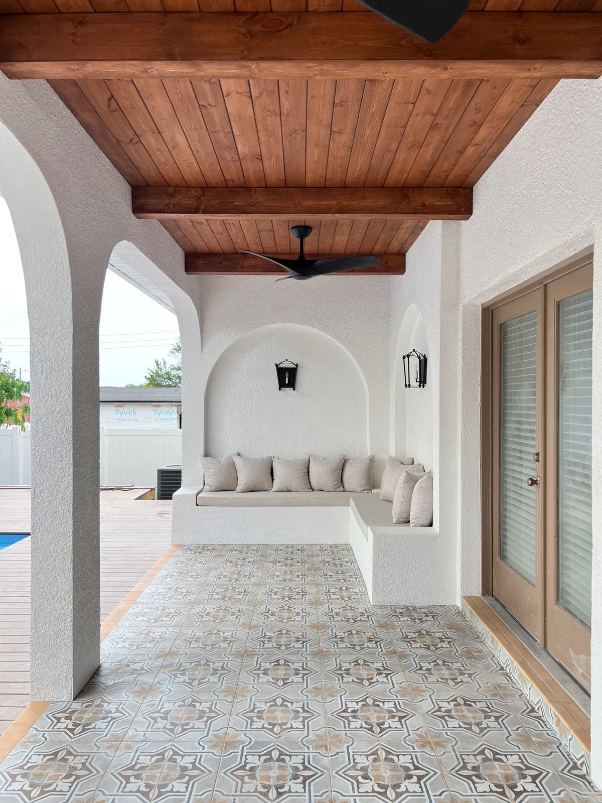 custom built in outdoor stucco sofa with arches