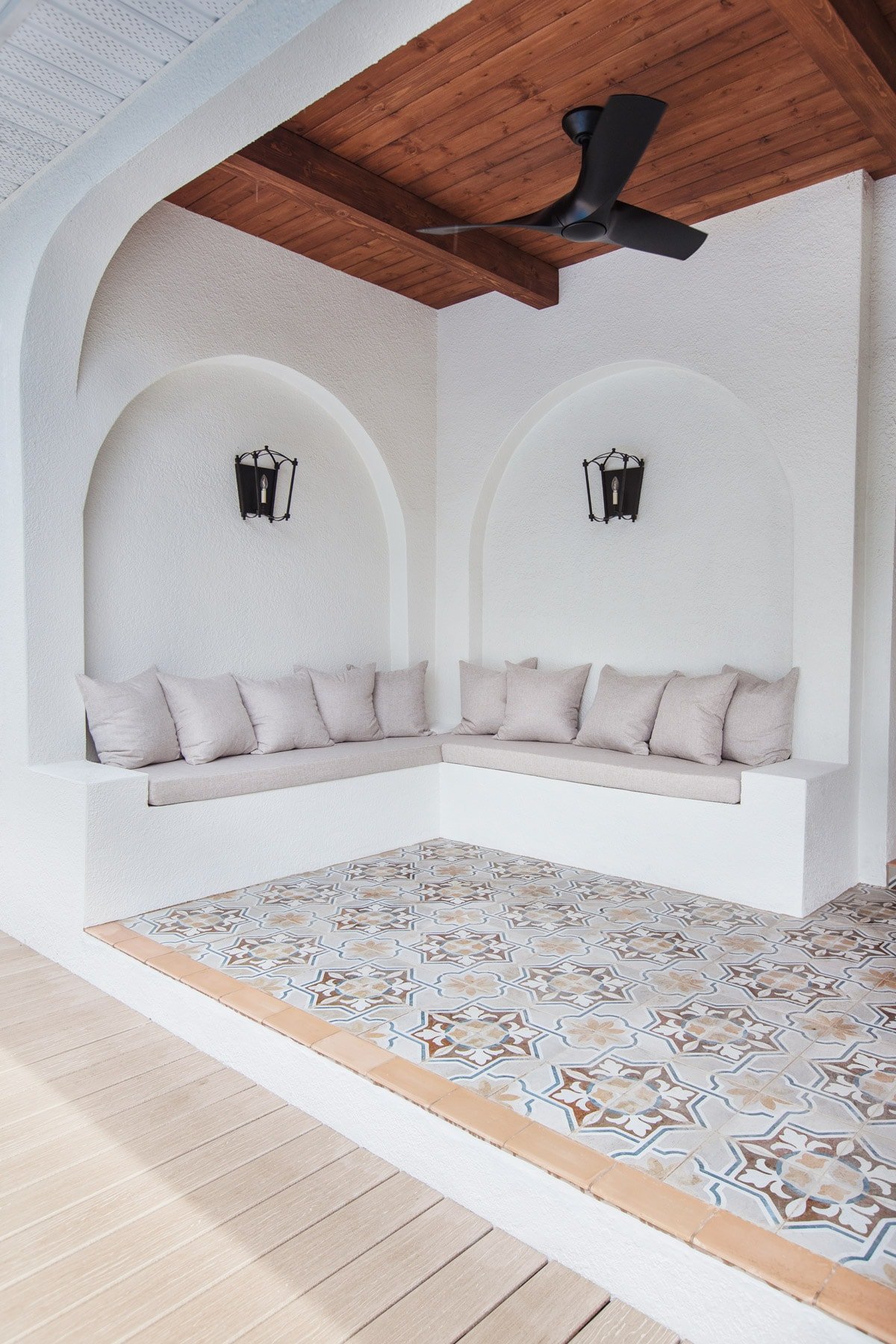 custom built in outdoor stucco sofa with arches