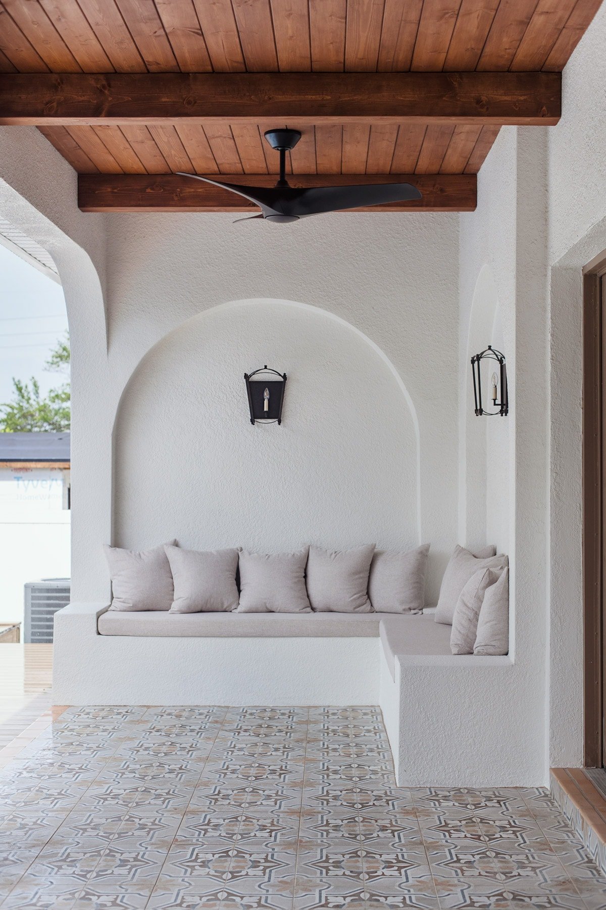 custom built in outdoor stucco sofa with arches