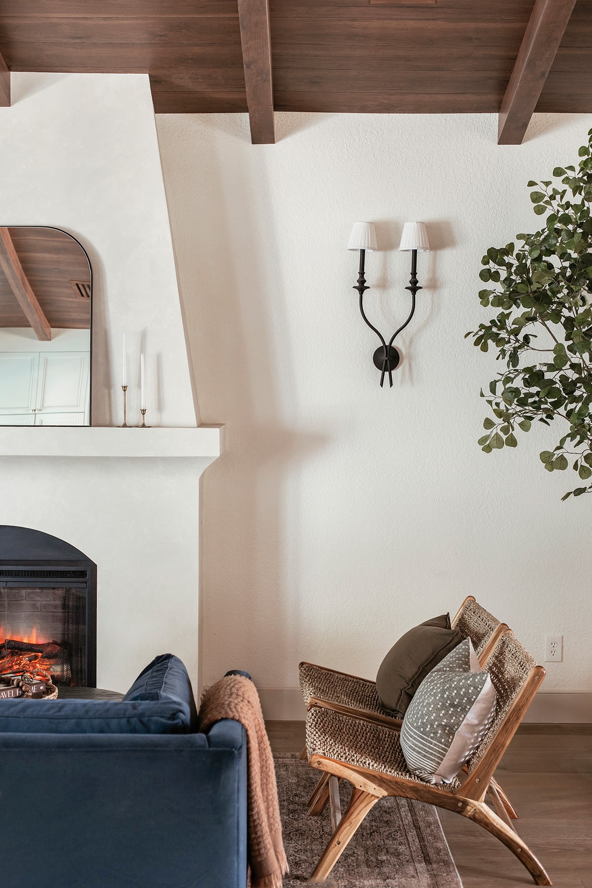 spanish style living room with diy electric fireplace and sw alabaster walls