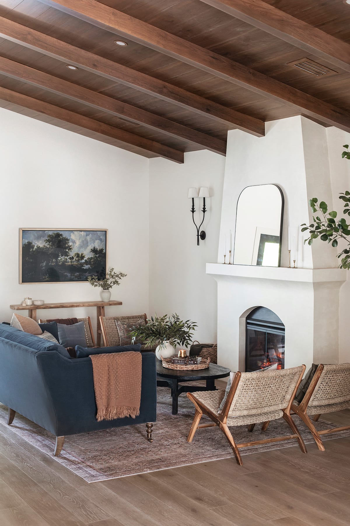 spanish style living room with diy electric fireplace and alabaster walls