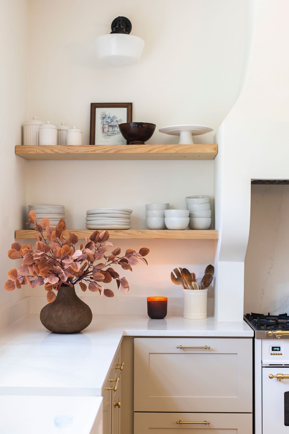 faux fall branches in vase in kitchen