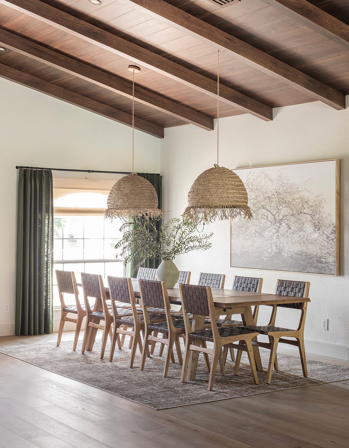 mediterranean style dining room with wood beam ceilings