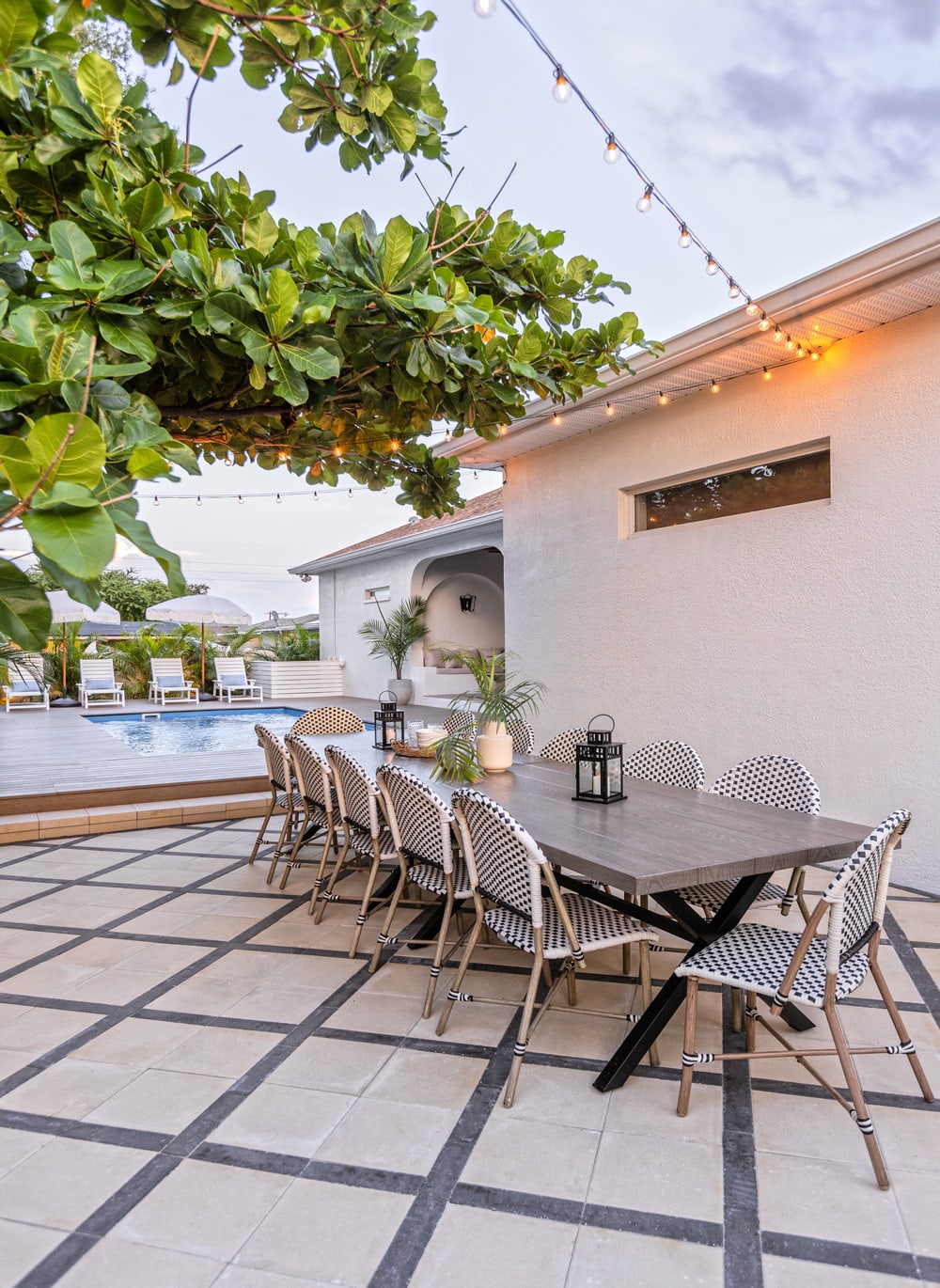 X paver patio with almond tree and dining area