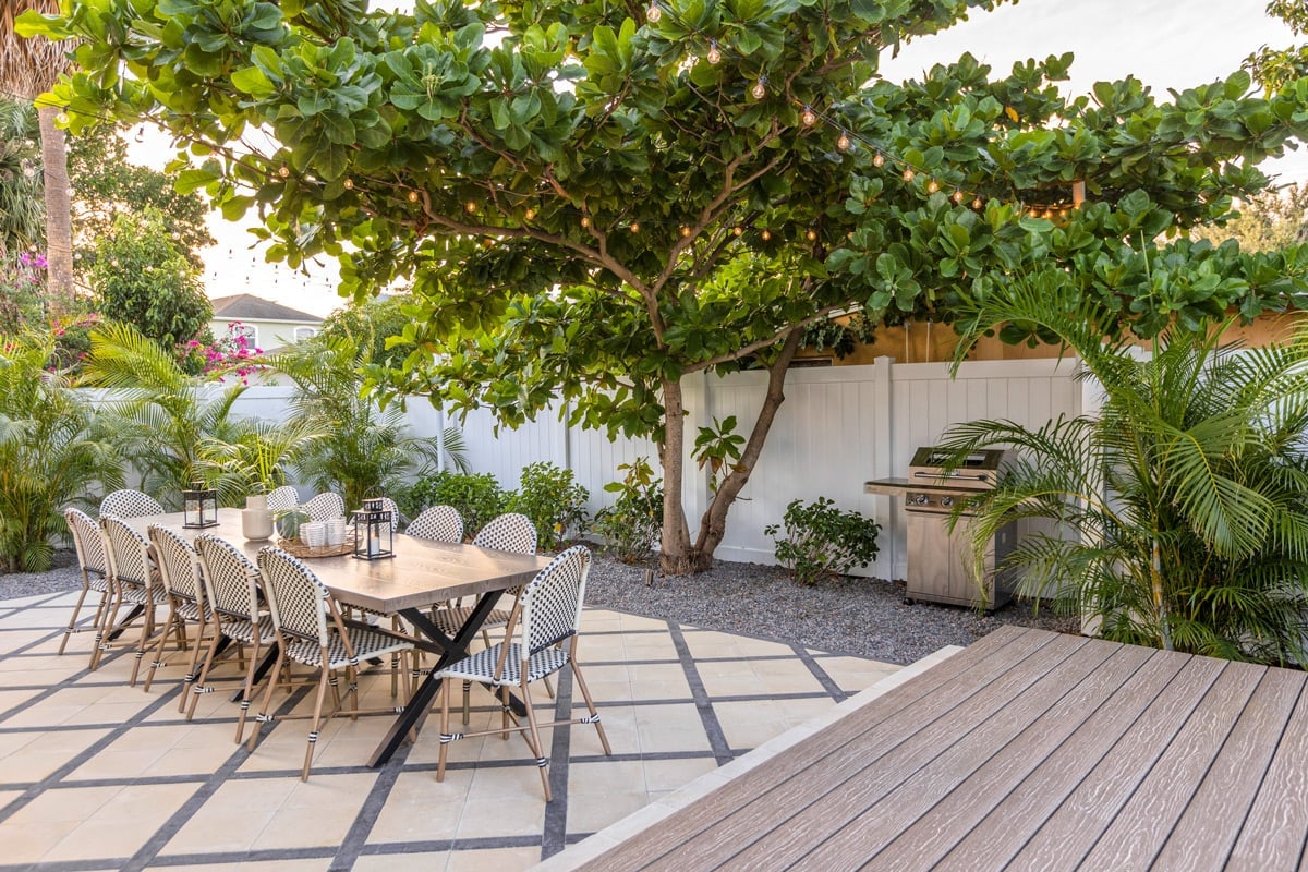 paver patio with almond tree and dining area