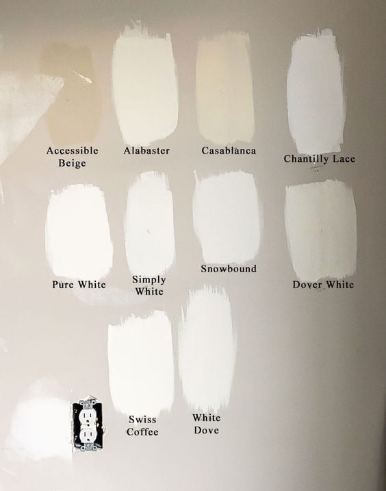 samples of popular white paint colors on a wall