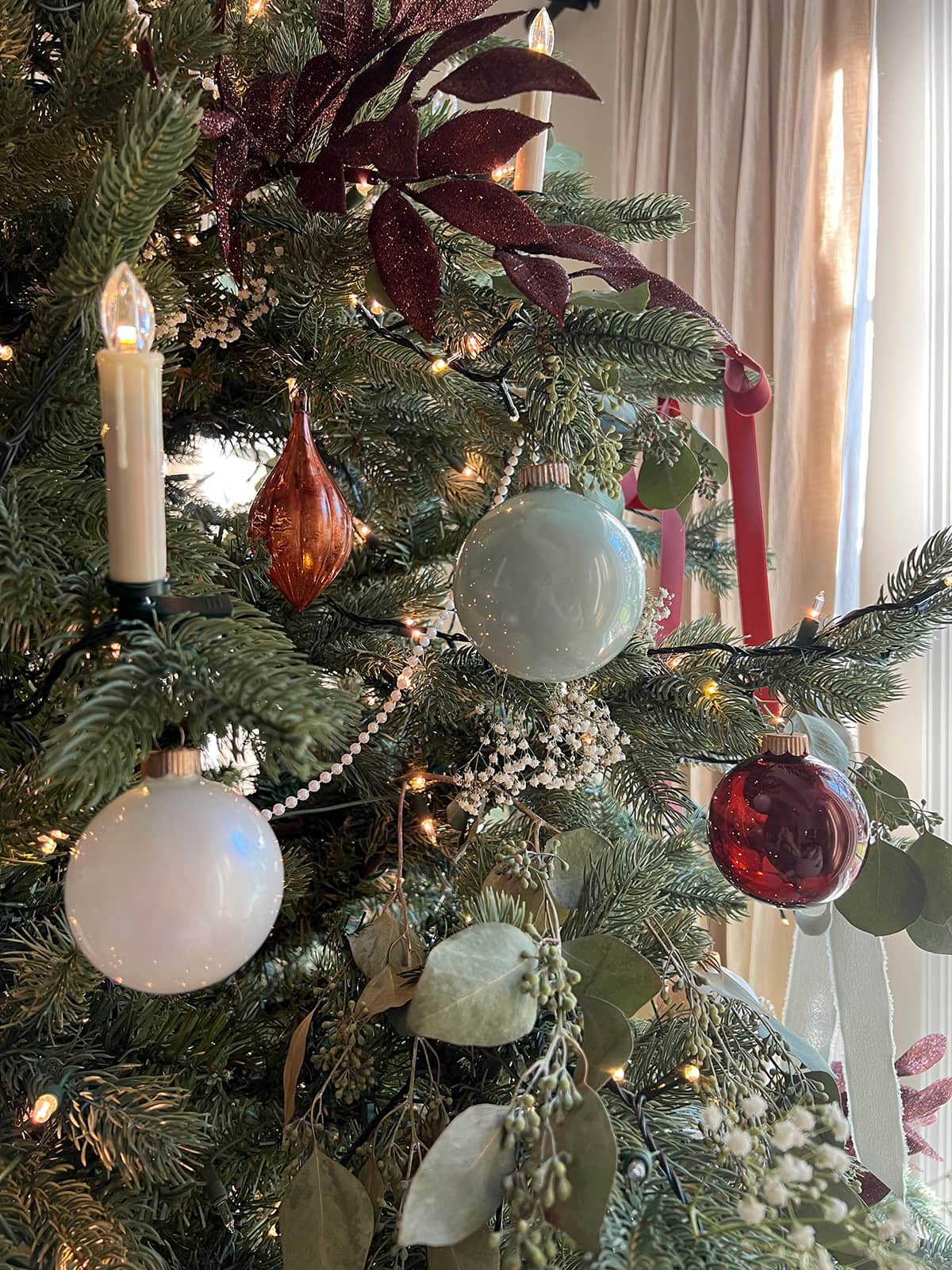 diy alcohol ink ornaments on a christmas tree