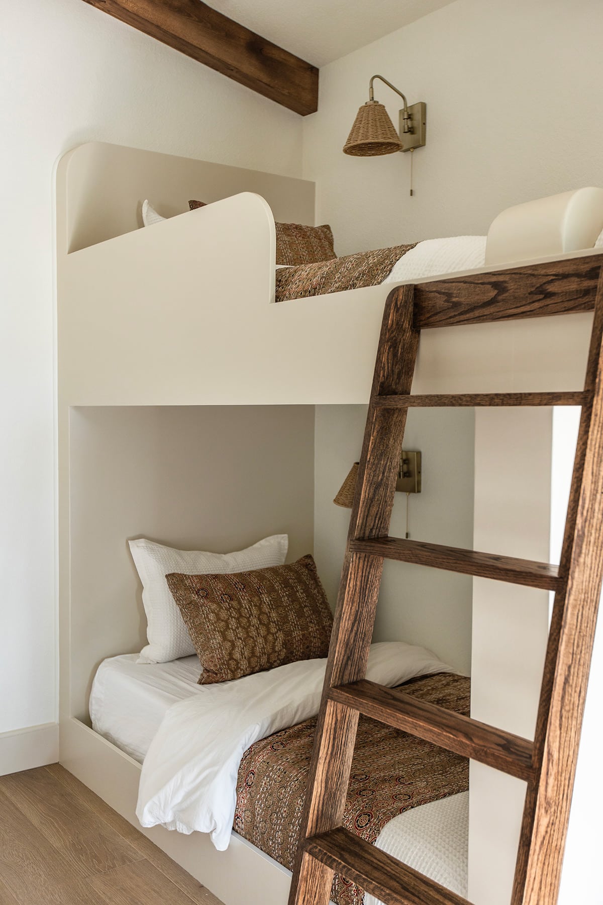 custom built twin bunk beds with stained wood ladder