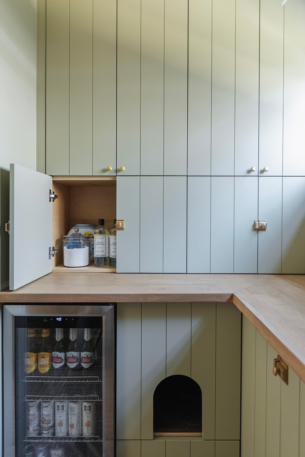 custom green laundry room cabinets in sherwin williams svelte sage