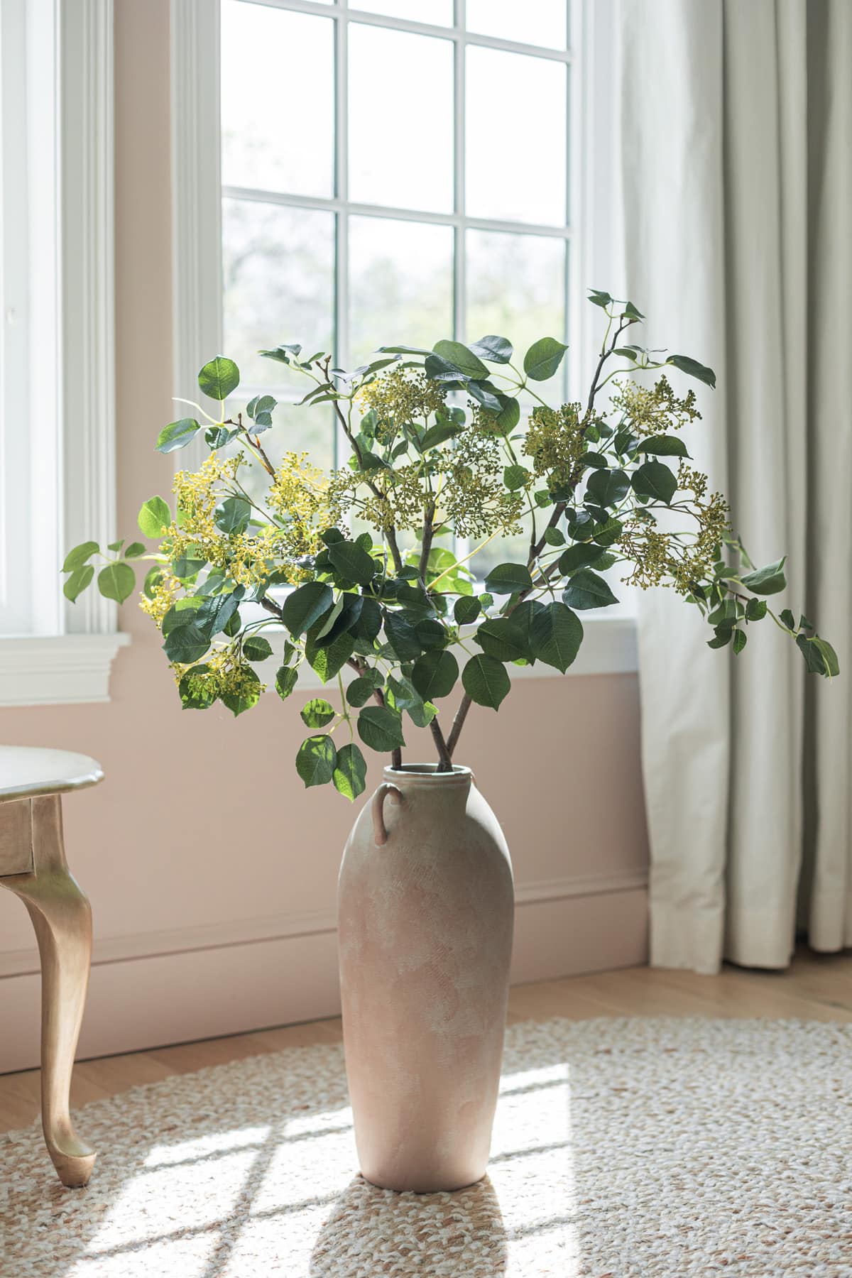 faux seeded privet branch in tall terracotta vase