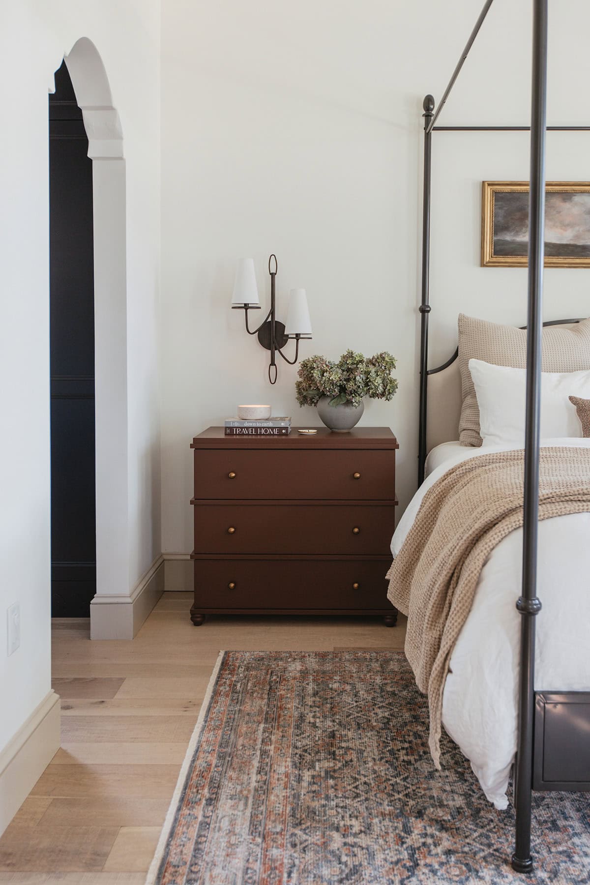 bedroom with dark brown painted nightstand chest