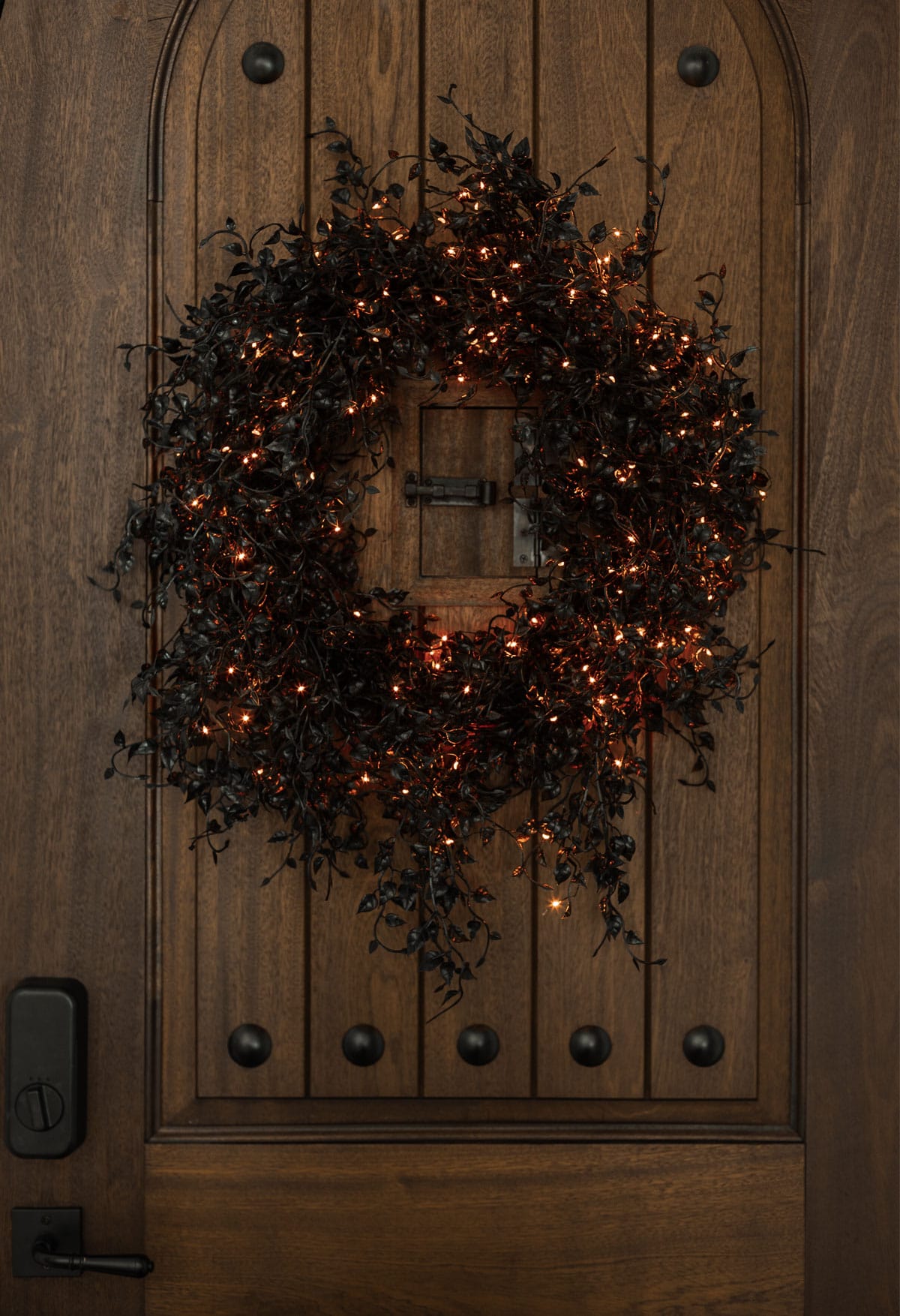 glowing black halloween wreath with black ivy