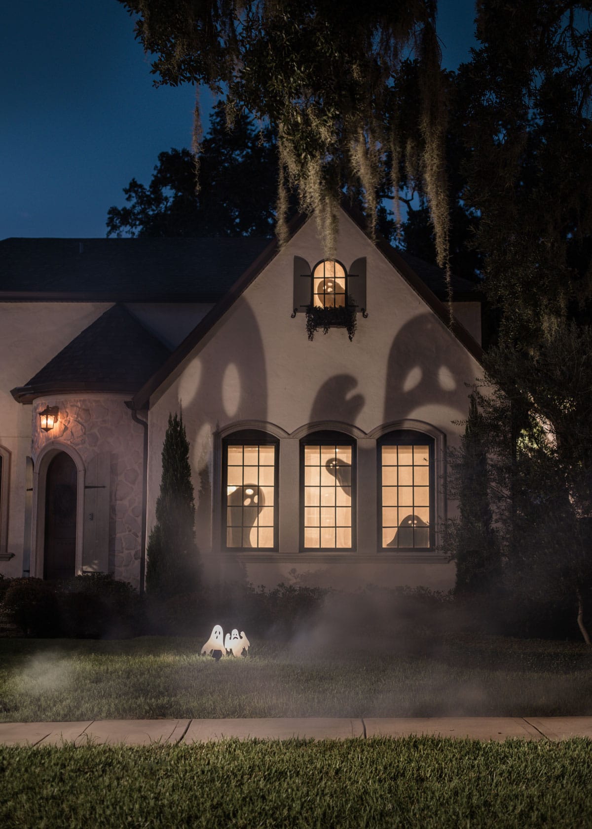 halloween exterior decor with ghost shadows