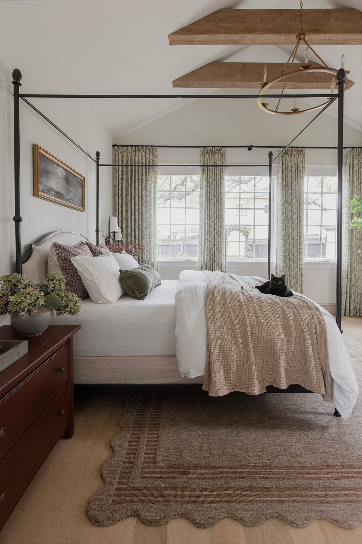 bedroom with canopy bed and loloi scottie rug in mocha