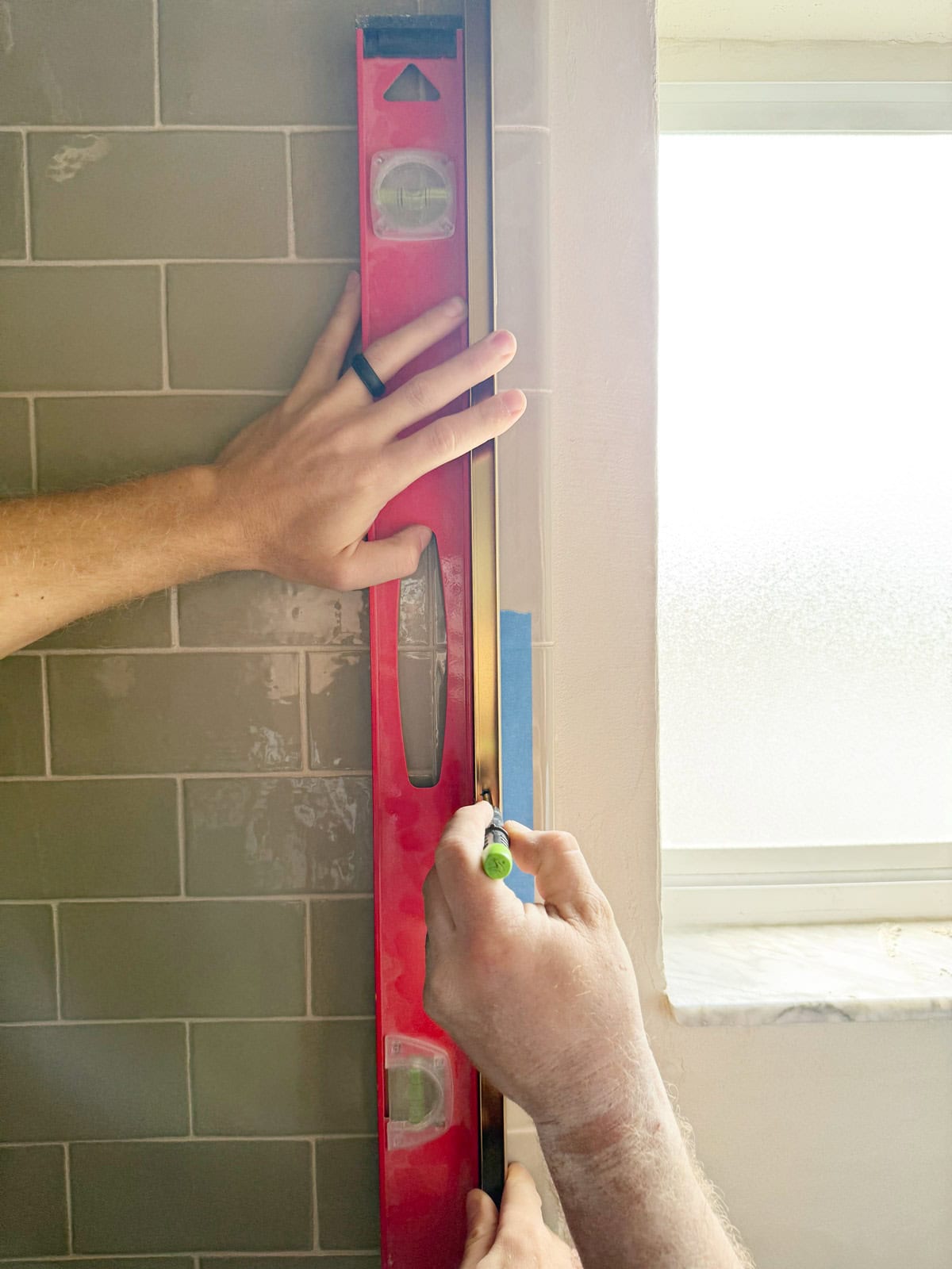 installing a shower screen on a tub