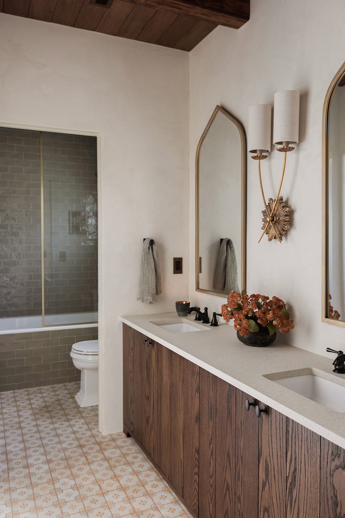 spanish style bathroom with dark oak wood vanity