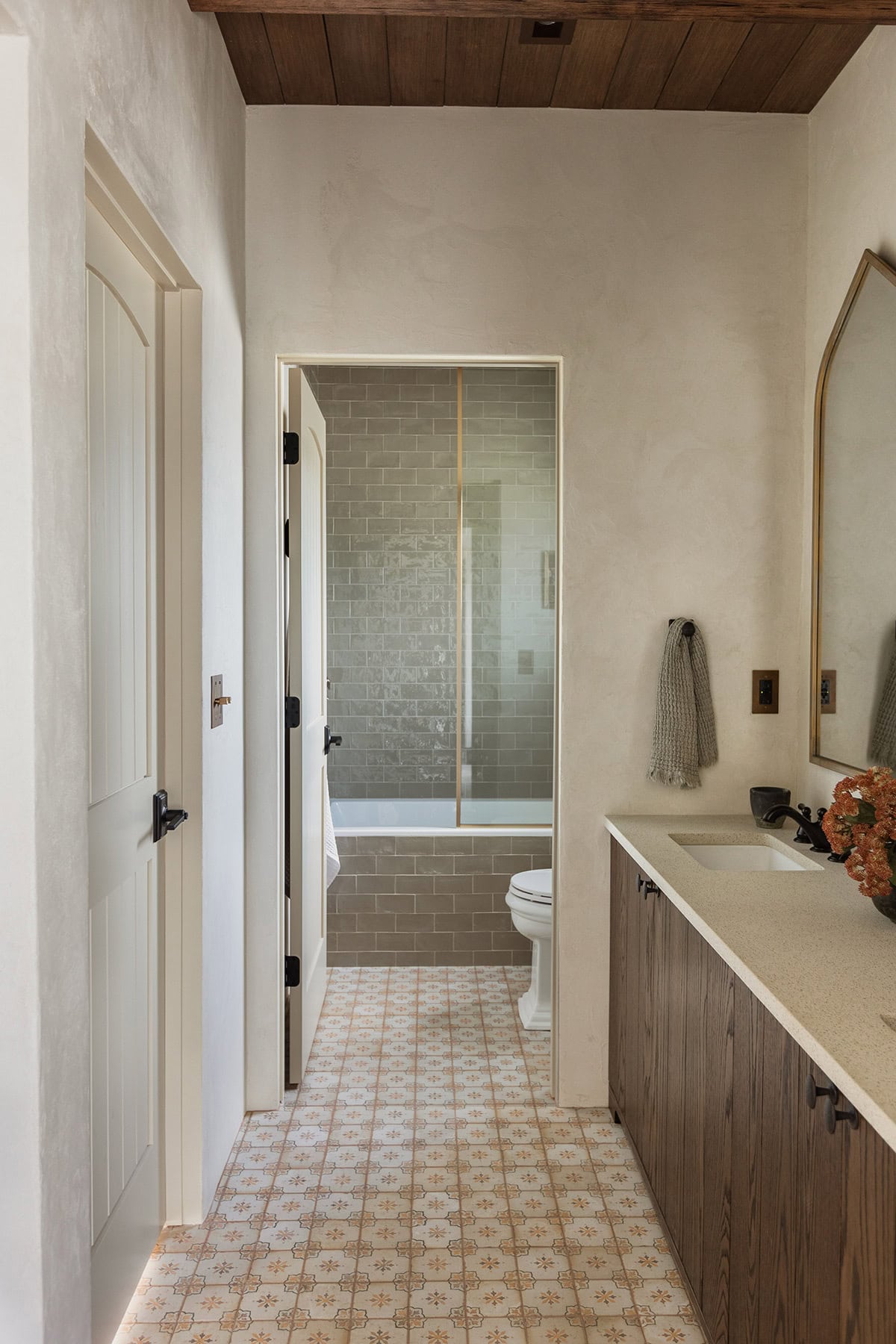 spanish style bathroom with dark oak wood vanity