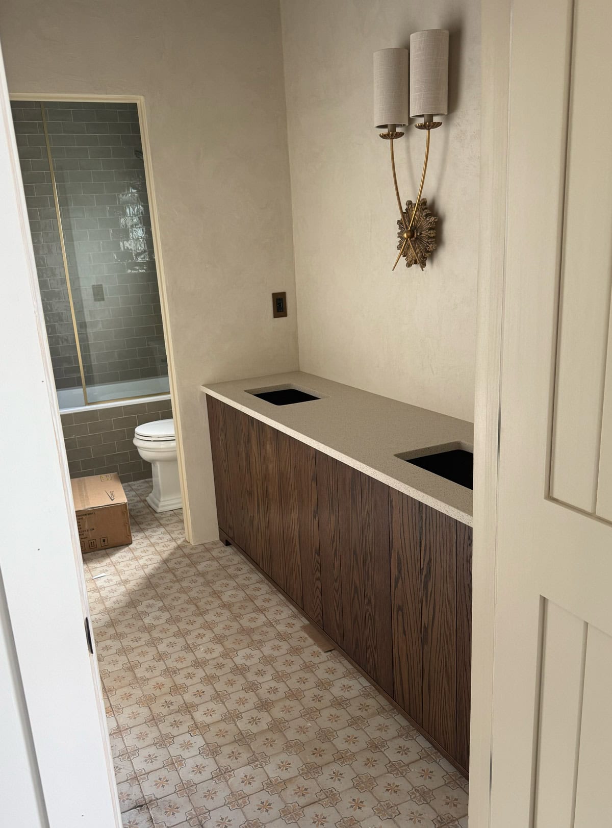 spanish style bathroom with dark oak wood vanity