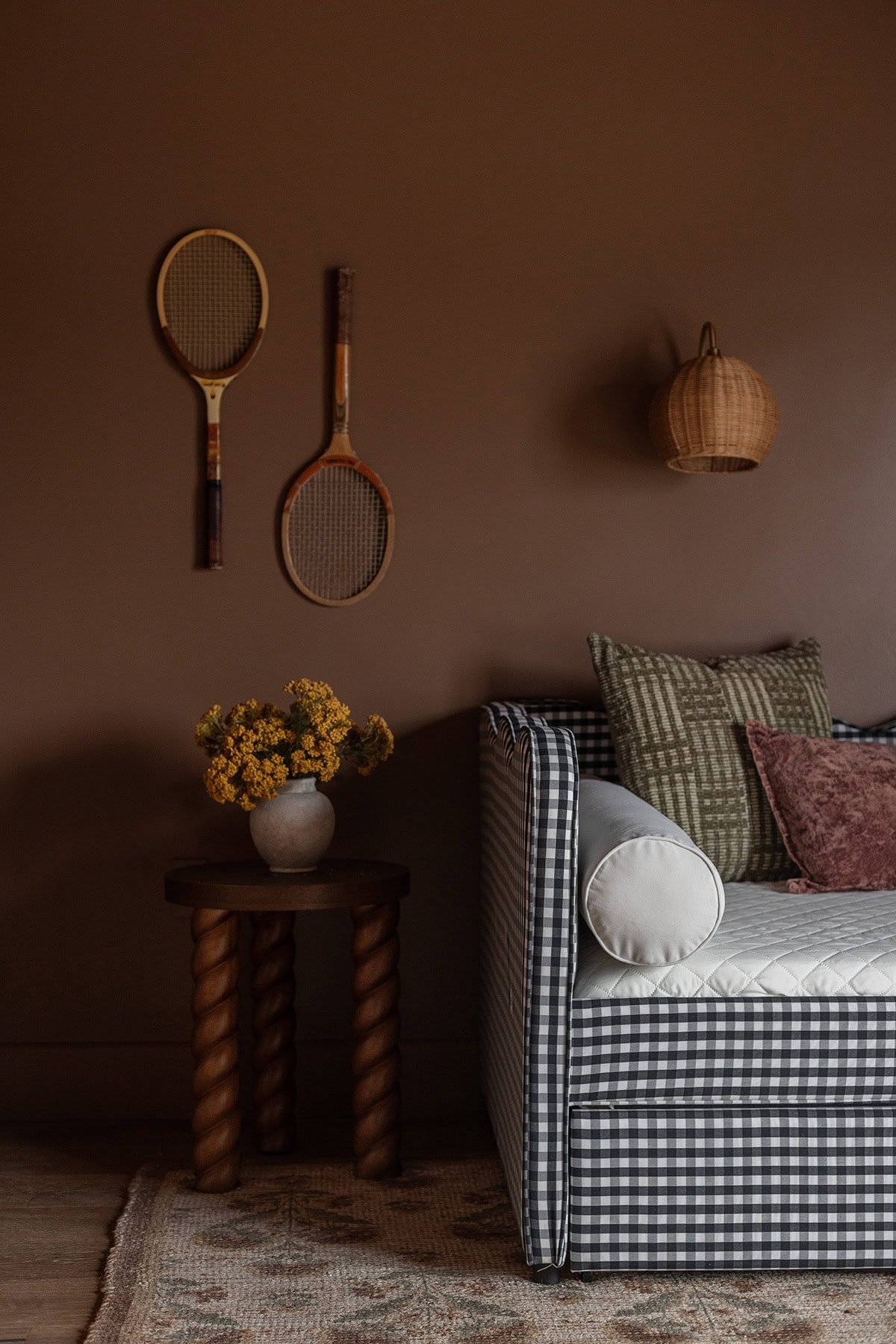 tennis rackets hanging on walls