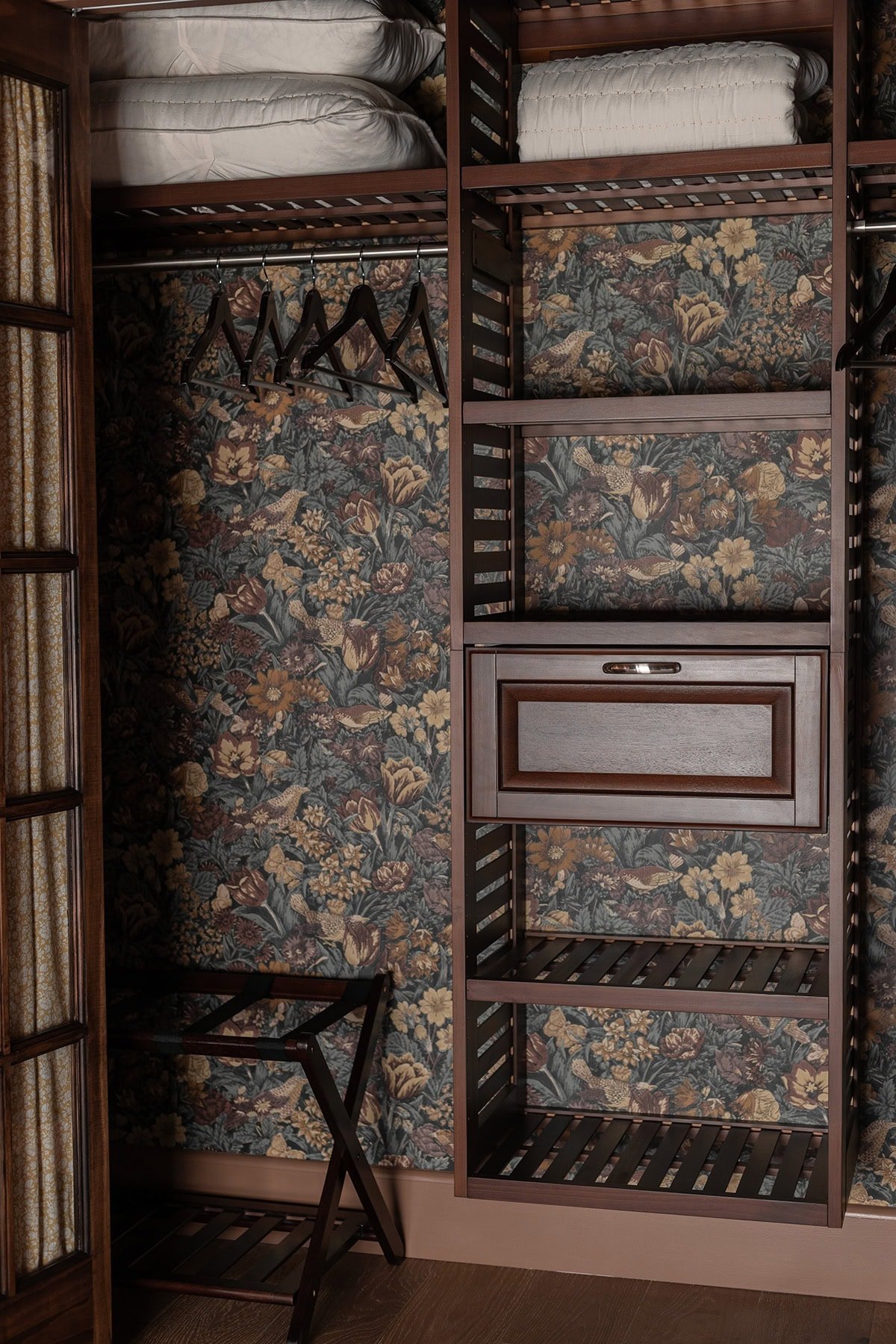 closet with floral wallpaper and wood system from lowes