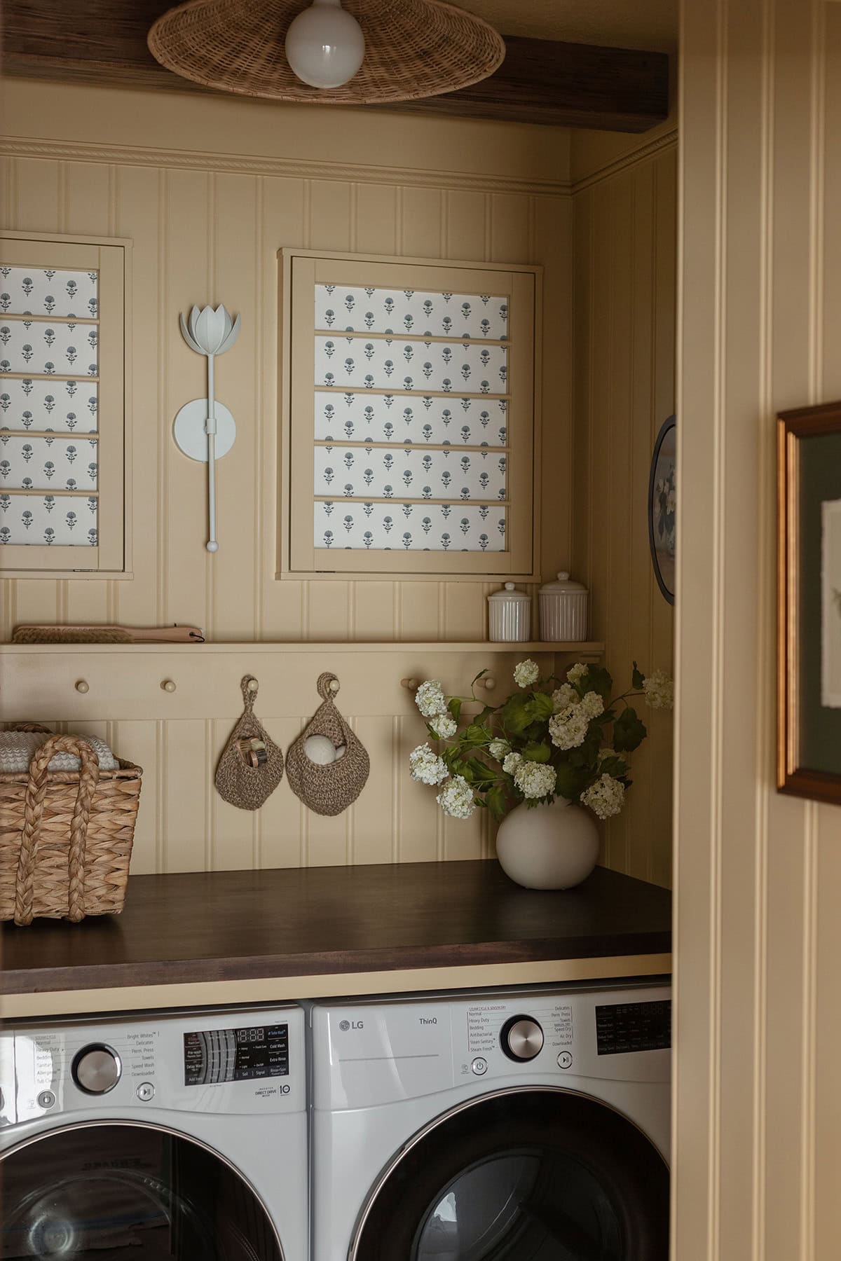 small cottage inspired yellow laundry room