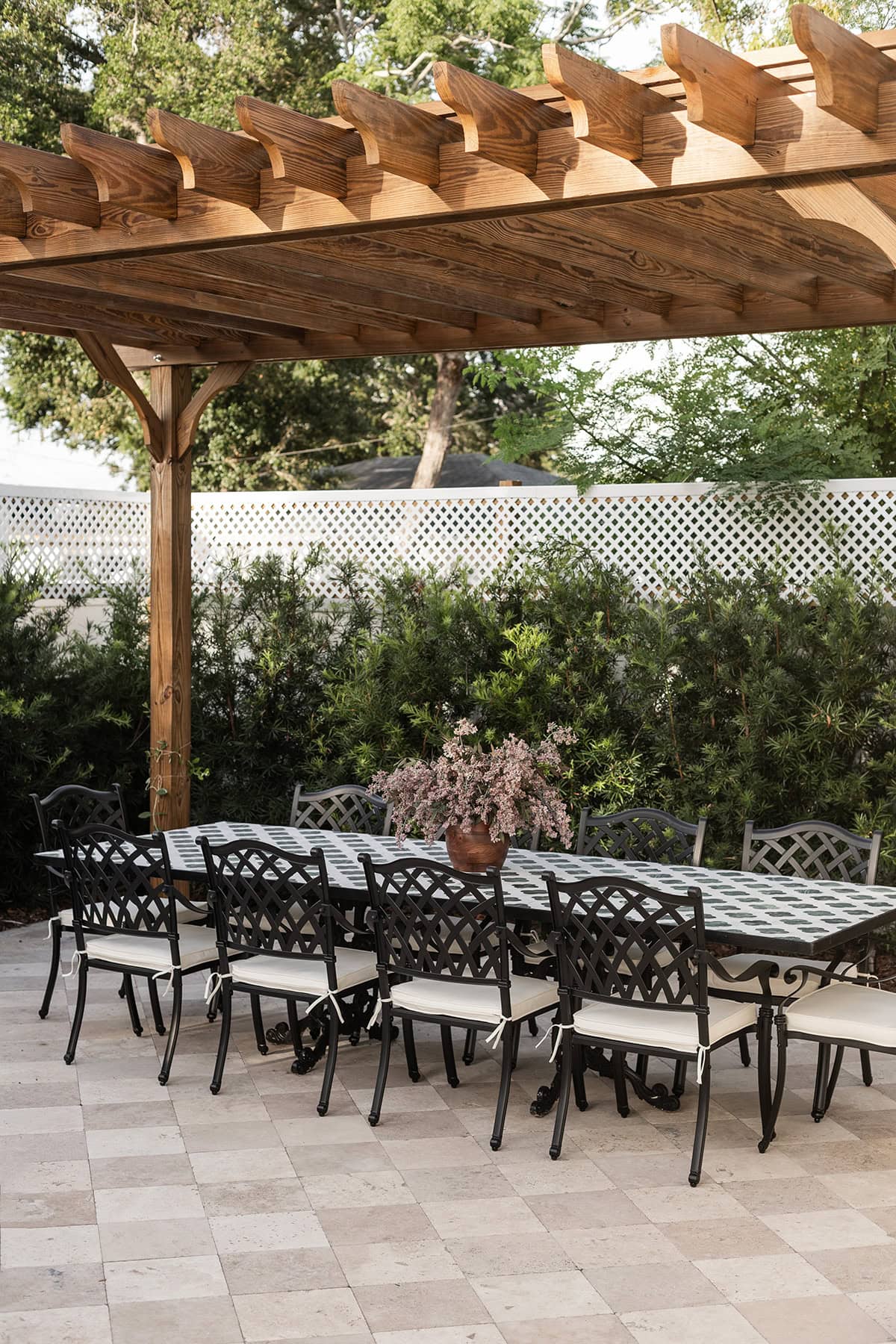 mediterranean outdoor tile dining table under a pergola