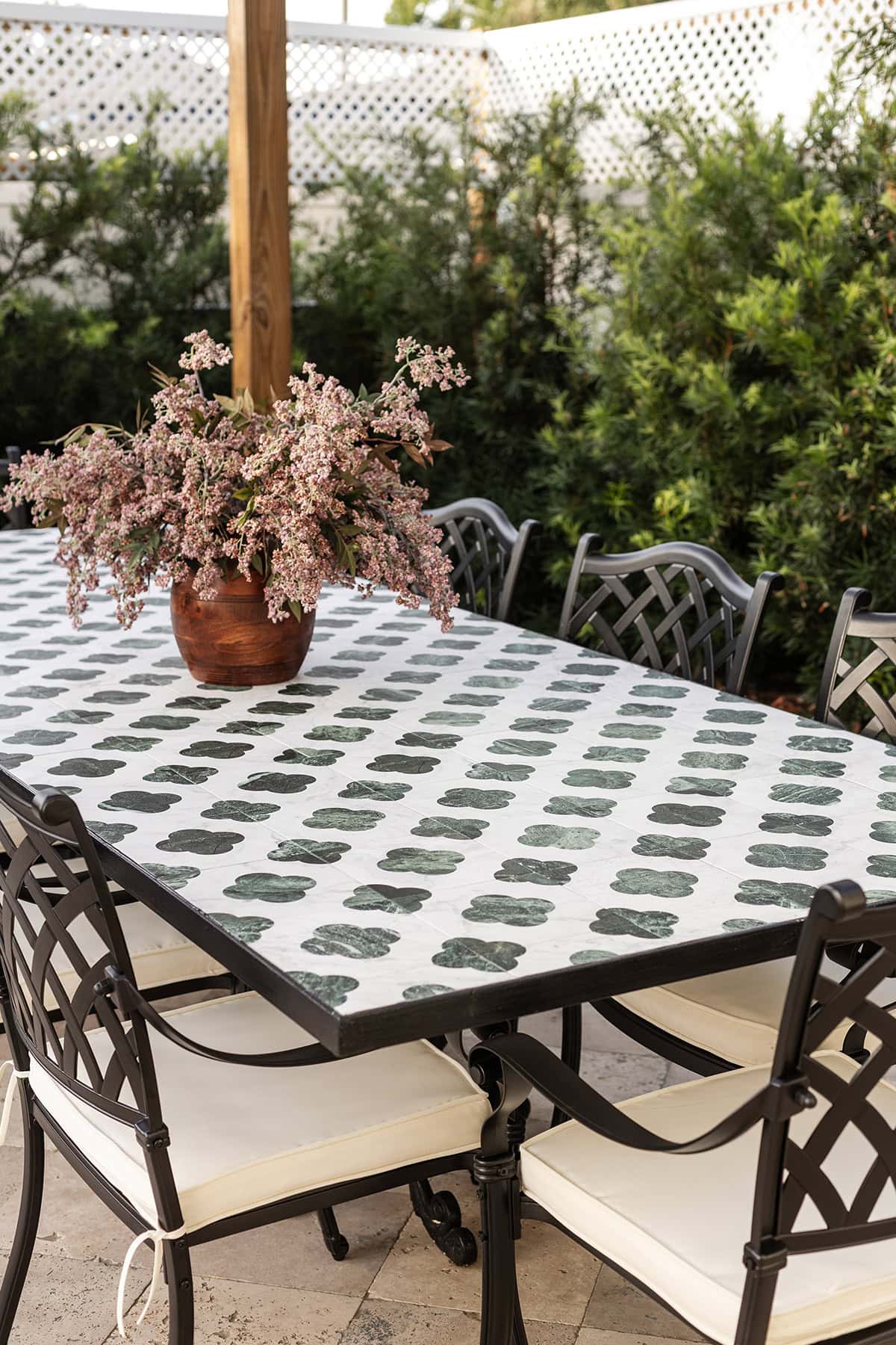 outdoor tile dining table under a pergola
